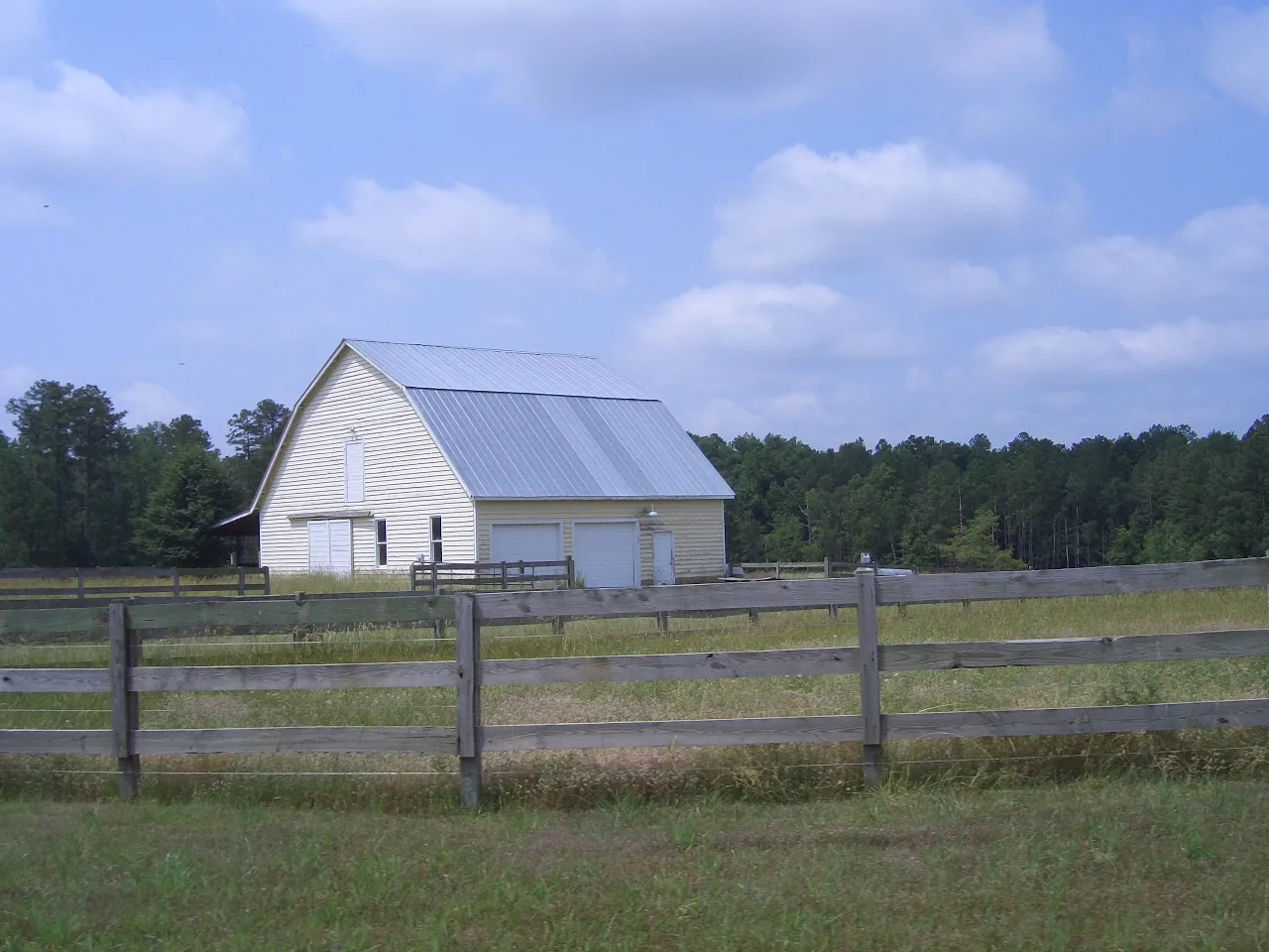A barn and fenced pasture near Green Hope High School in western Cary.