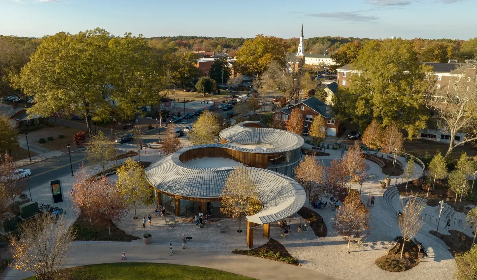 An aerial view of Downtown Cary Park in the fall, beside the stretch of Park Street where the Cary Downtown Farmers Market sets up on Saturdays.