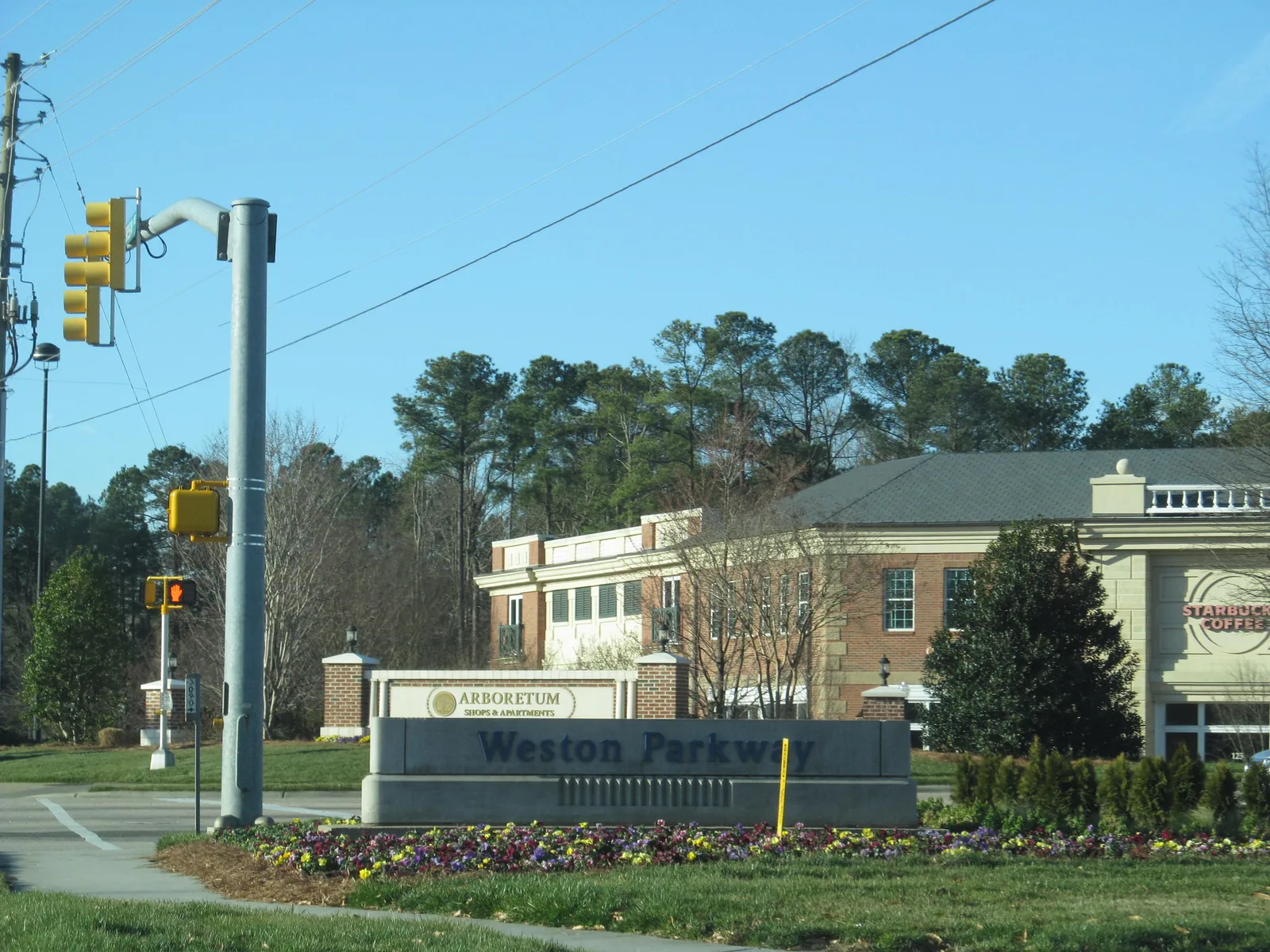 The Weston Parkway sign in front of the Arboretum shops and apartments in north Cary
