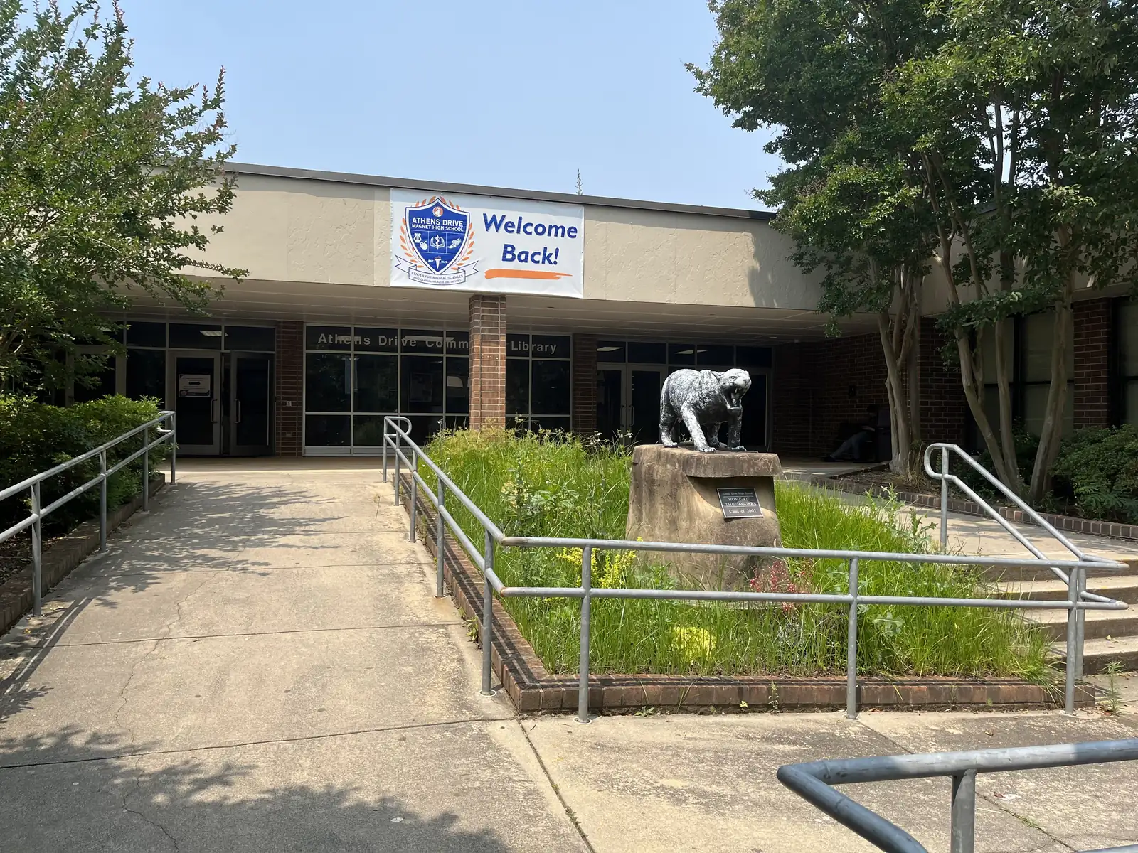 The library entrance of Athens Drive Magnet High School in Raleigh, with a jaguar statue out front