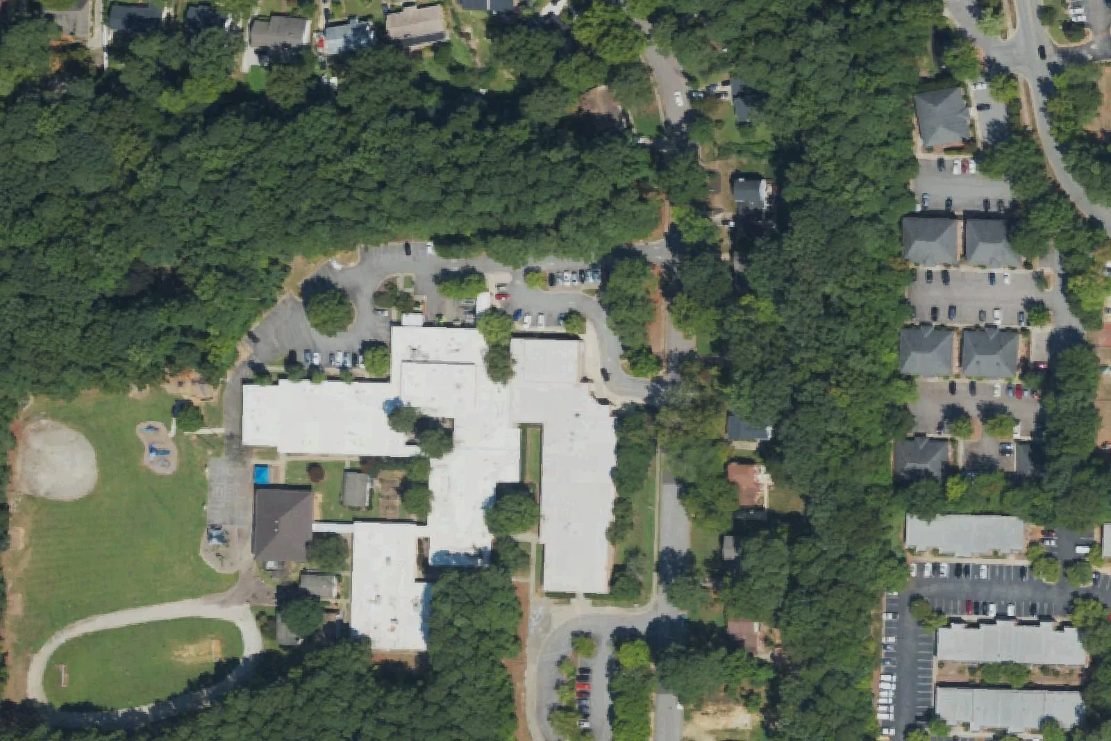 Briarcliff Elementary School's wings and playfield off Pond Street, seen from the air