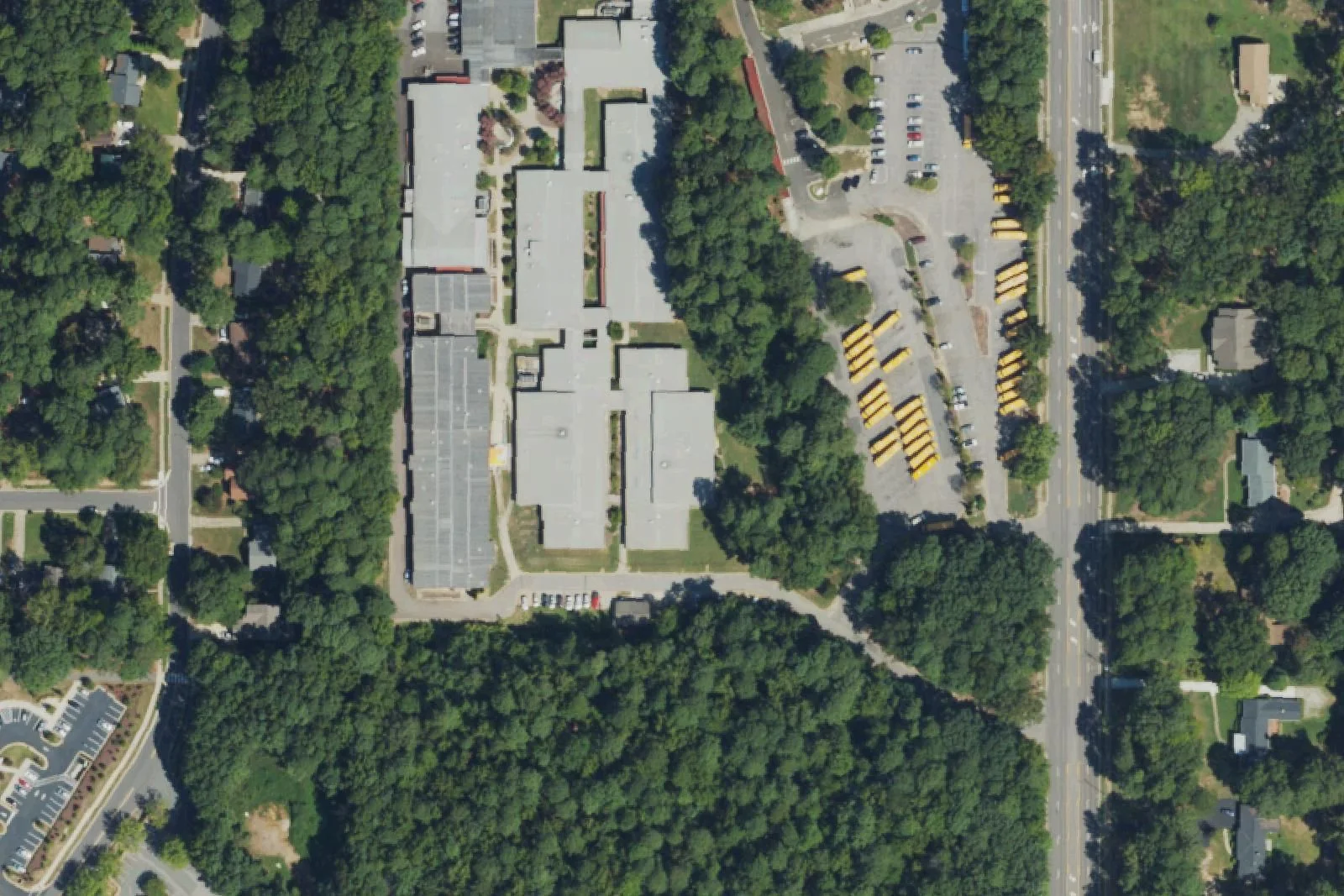 East Cary Magnet Middle School's building and bus lot off Southeast Maynard Road, seen from the air