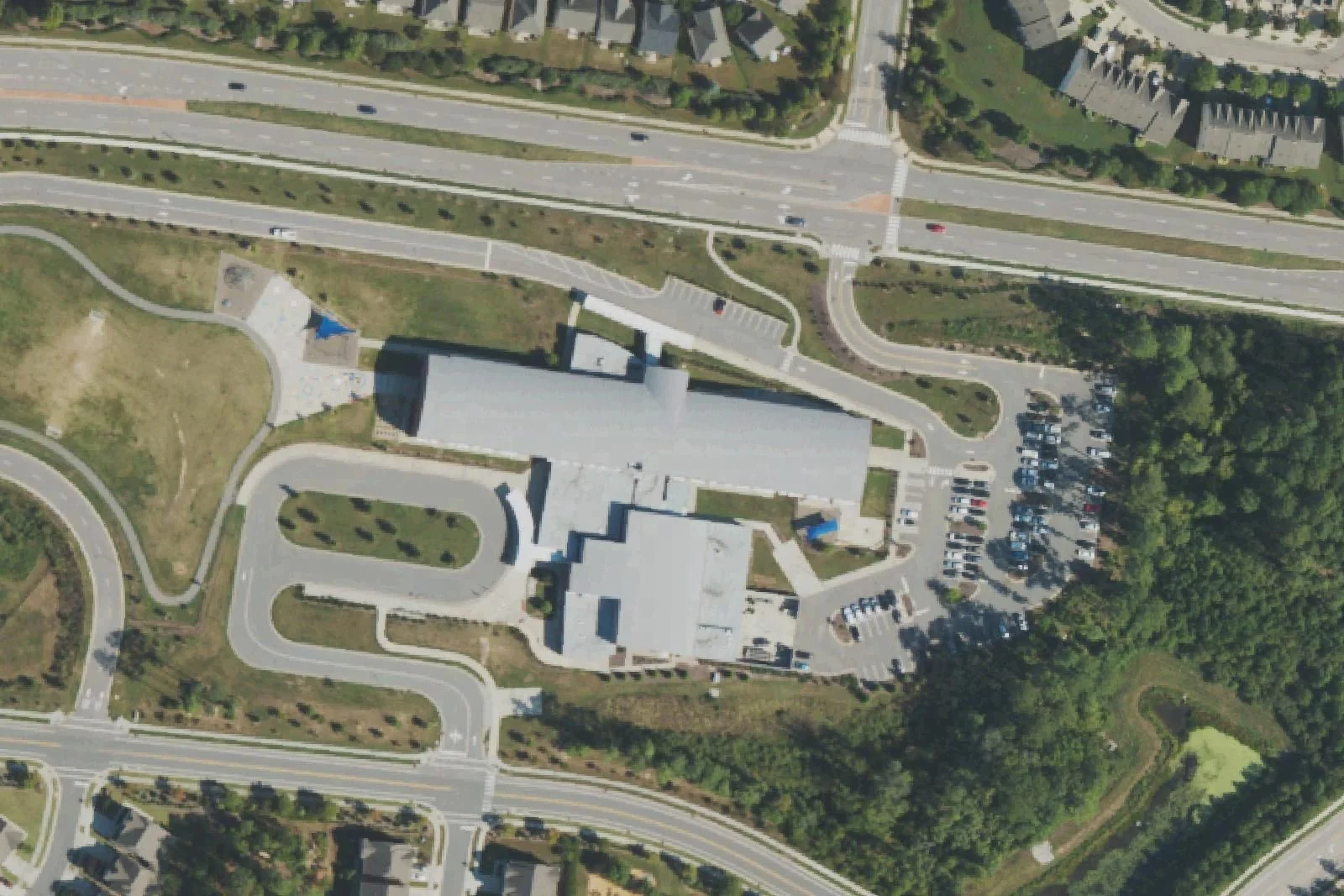 Hortons Creek Elementary School's building and car loop on O'Kelly Chapel Road, seen from the air