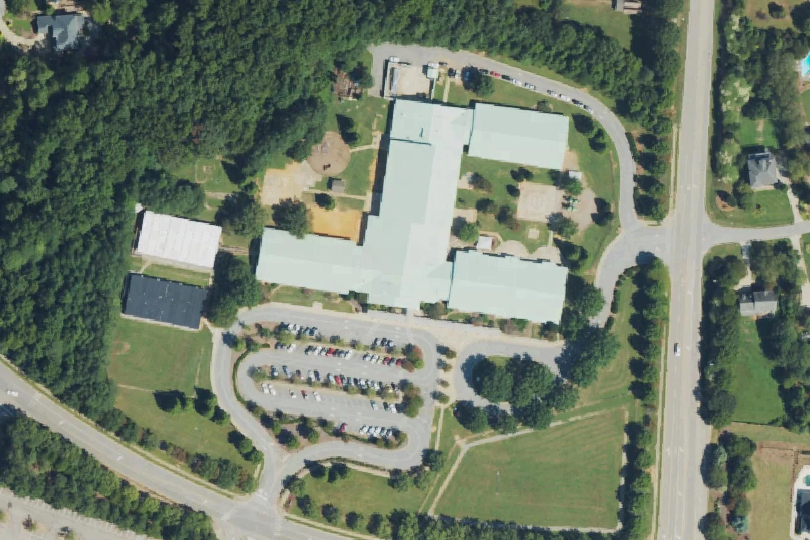 Middle Creek Elementary School's wings and car loop off Middle Creek Park Avenue, seen from the air