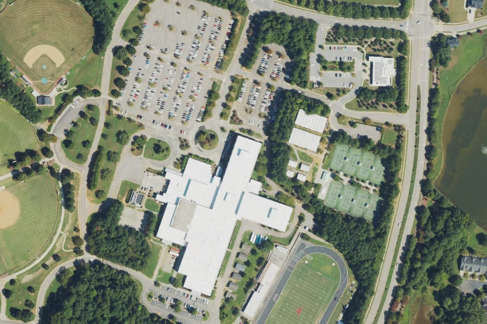 Middle Creek High School's main building, stadium, tennis courts and softball field off Middle Creek Park Avenue, seen from the air