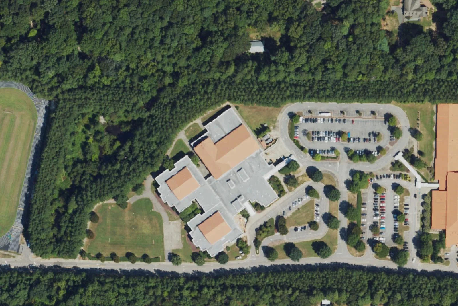 Reedy Creek Magnet Middle School's building and parking loop on Reedy Creek Road, seen from the air