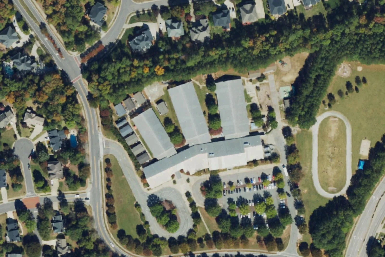 Weatherstone Elementary School's wings and track off Olde Weatherstone Way, seen from the air