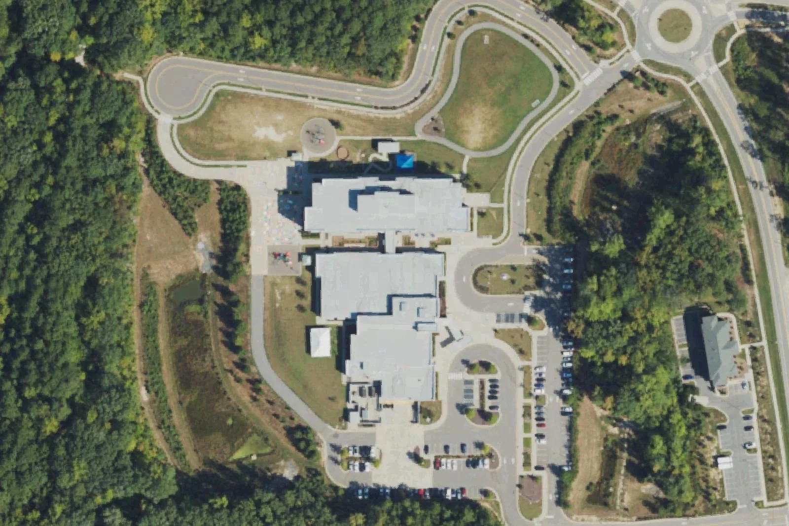 White Oak Elementary School's three-story building and car loop off White Oak Church Road, seen from the air