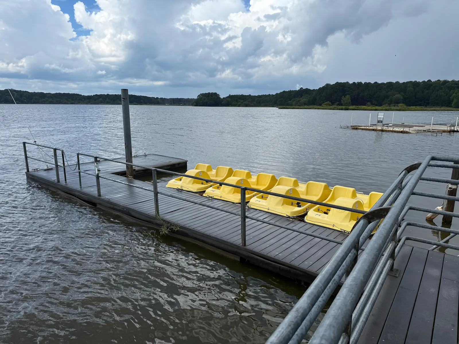 Yellow pedal boats docked for rent at Wake County's Lake Crabtree County Park, near Cary.